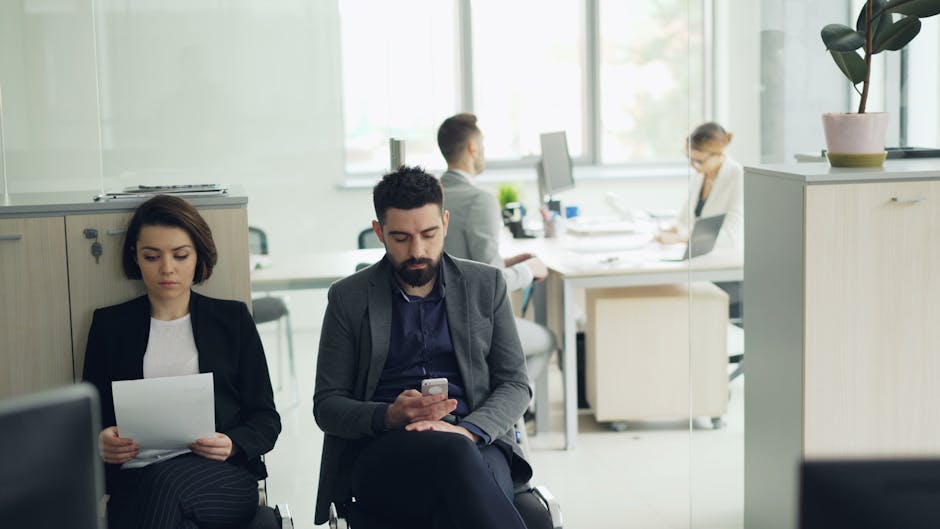 Business people focus on work in a modern open office space. Professional environment.